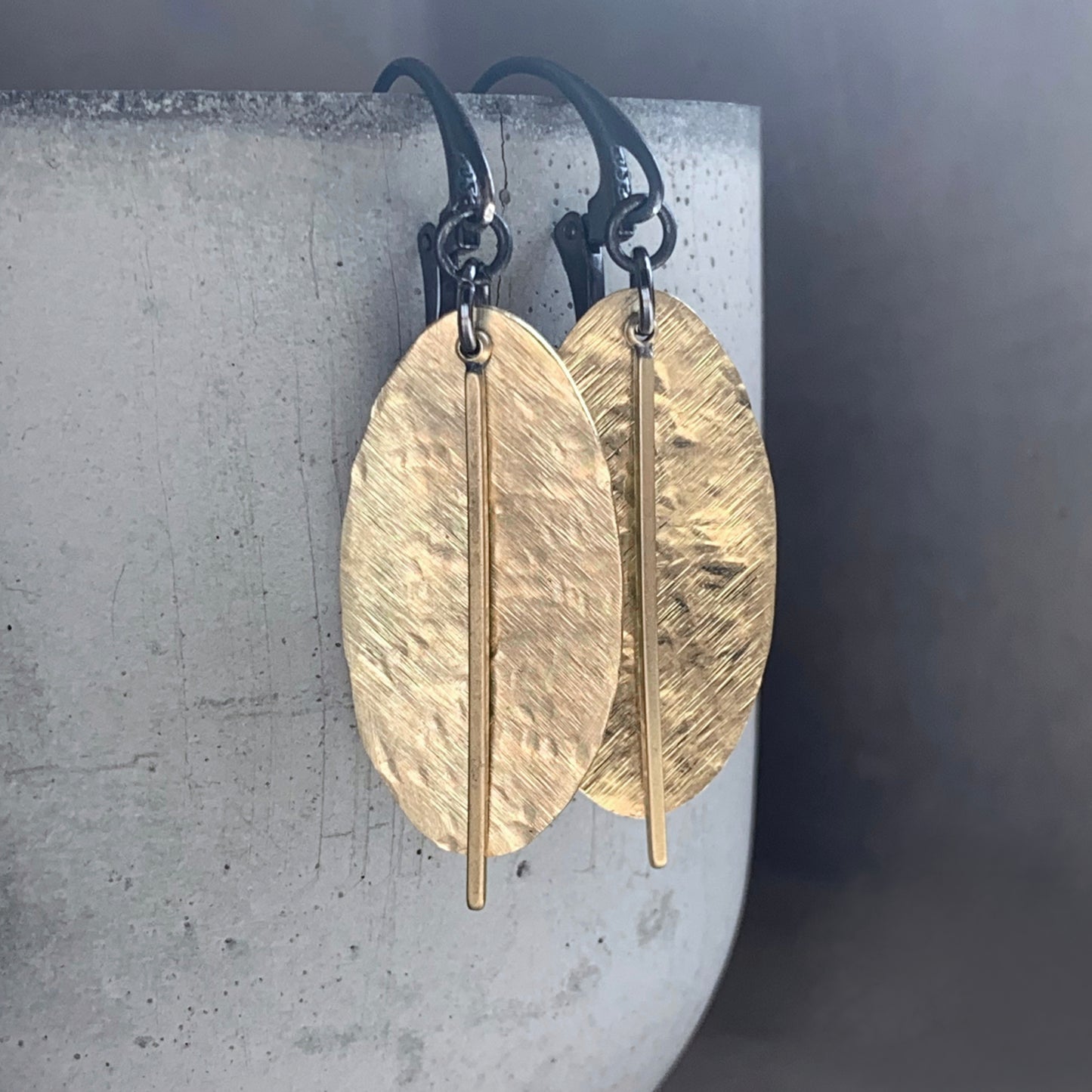 Earrings of raw brass and silver 'Gold Leaves'