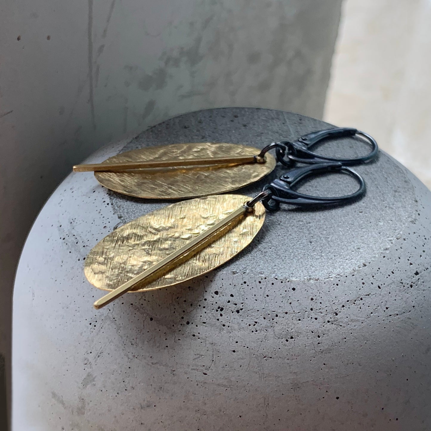 Earrings of raw brass and silver 'Gold Leaves'