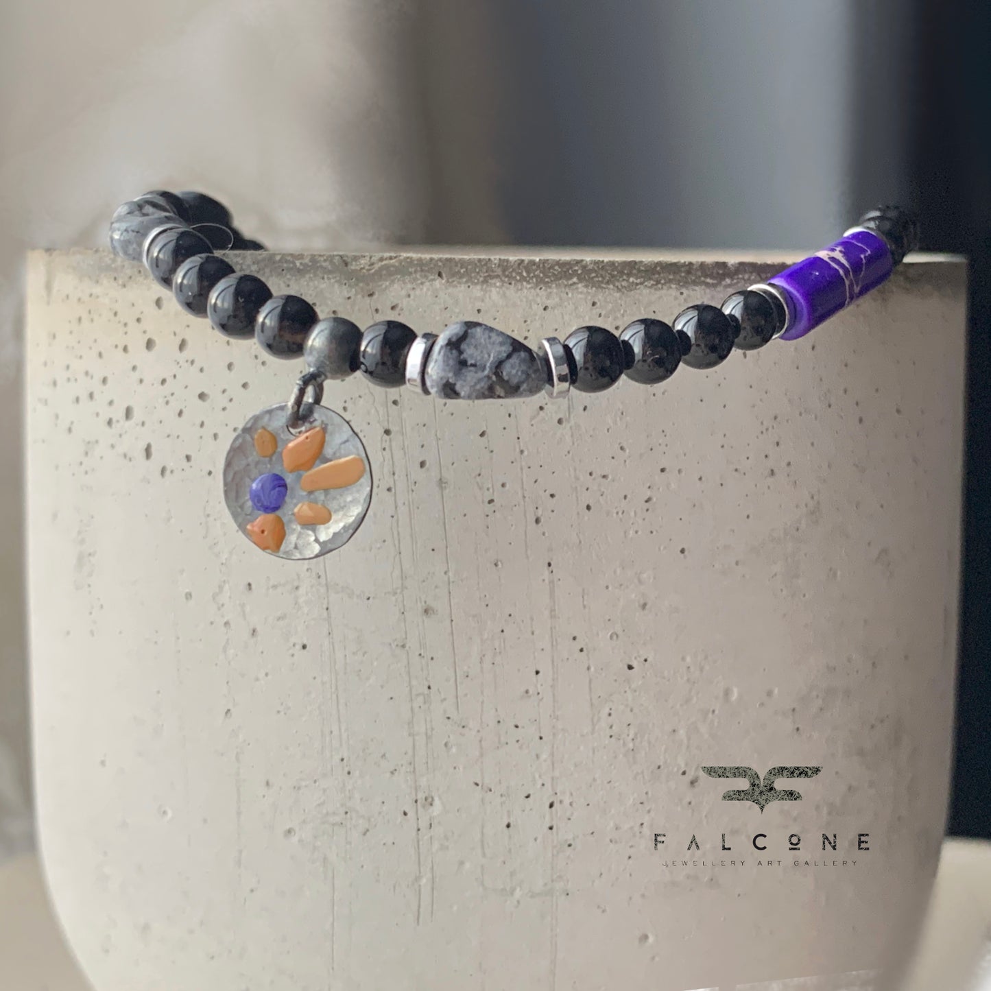 Bracelet of obsidian, imperial jasper and onyx with sterling silver enameled pendant 'Dalmatian with Flower'