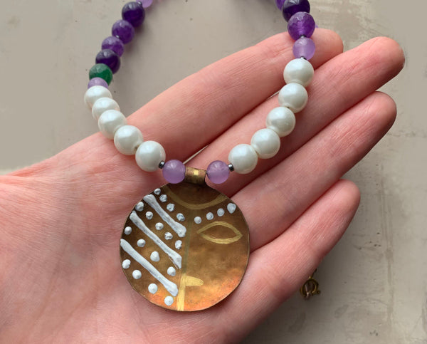 Necklace with engraved and enameled brass pendant, glass pearls and natural stones 'Africana in Purple'