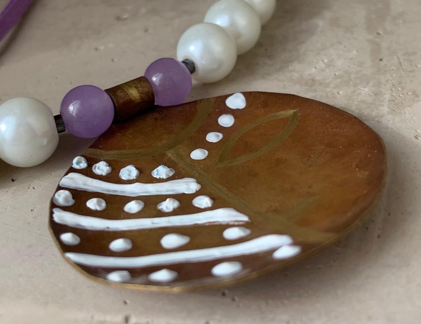 Necklace with engraved and enameled brass pendant, glass pearls and natural stones 'Africana in Purple'