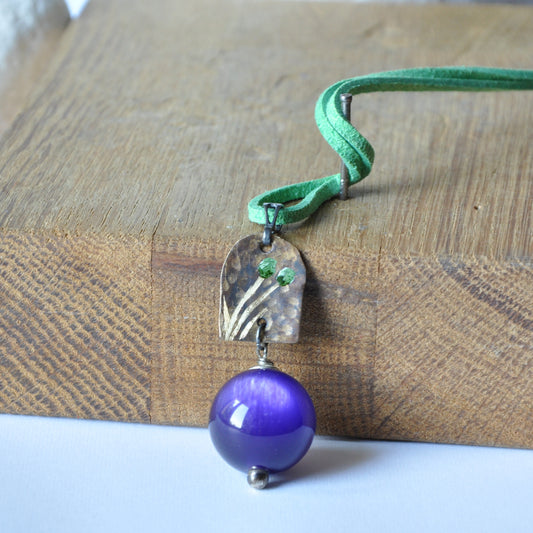 Necklace with patinated brass and engraved pendant and resin ball 'In Green Flowers and Purple'
