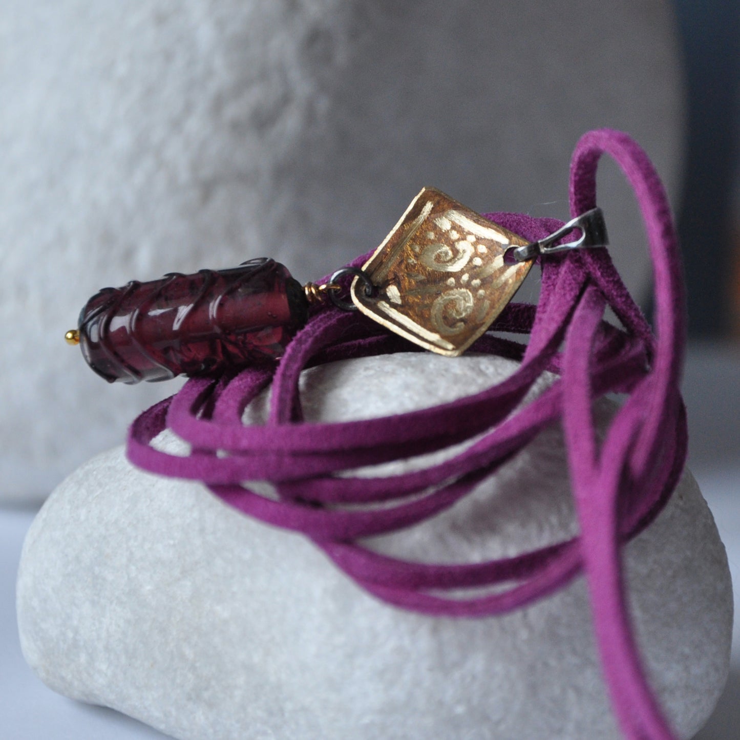 Necklace with patinated and hand-engraved brass pendant and glass cylinder 'Eggplant with Gold Glitter'