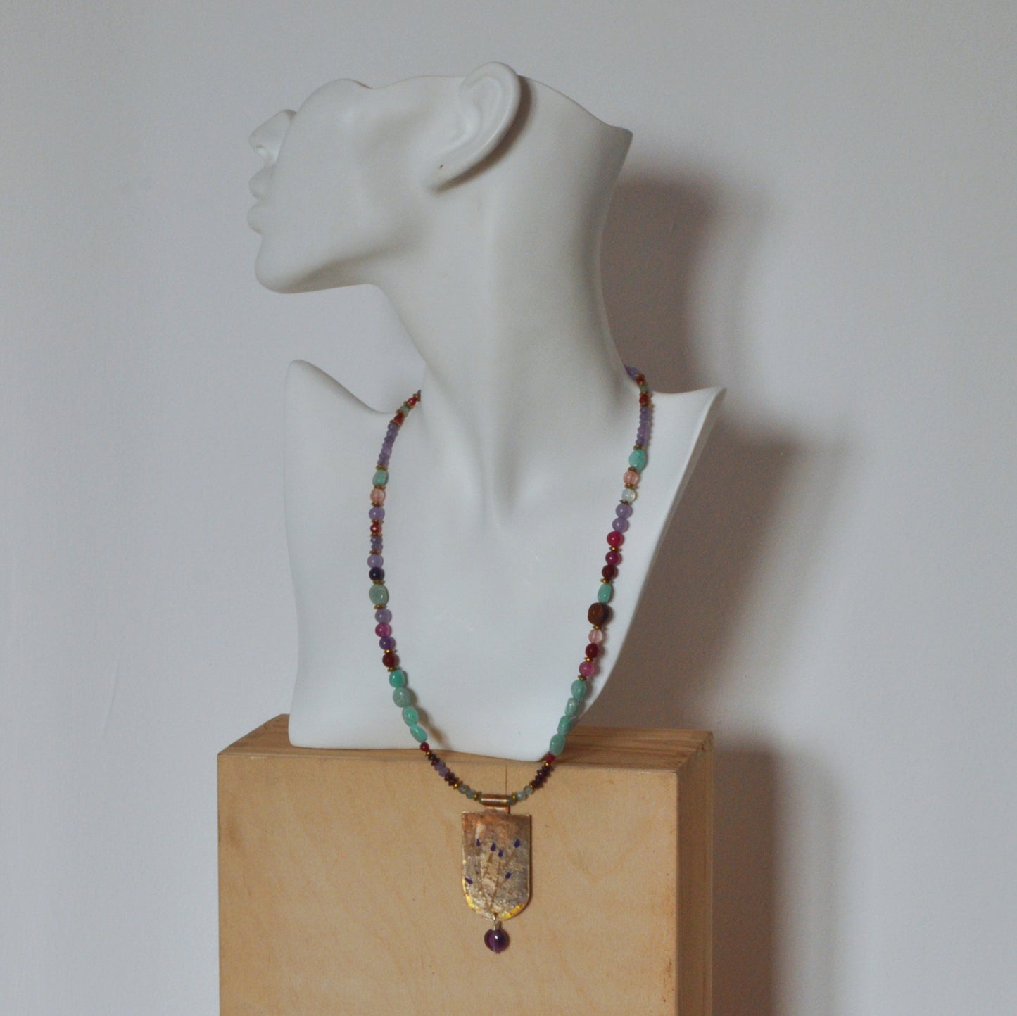 Necklace with engraved and enameled brass pendant and gemstones 'Secret Garden'