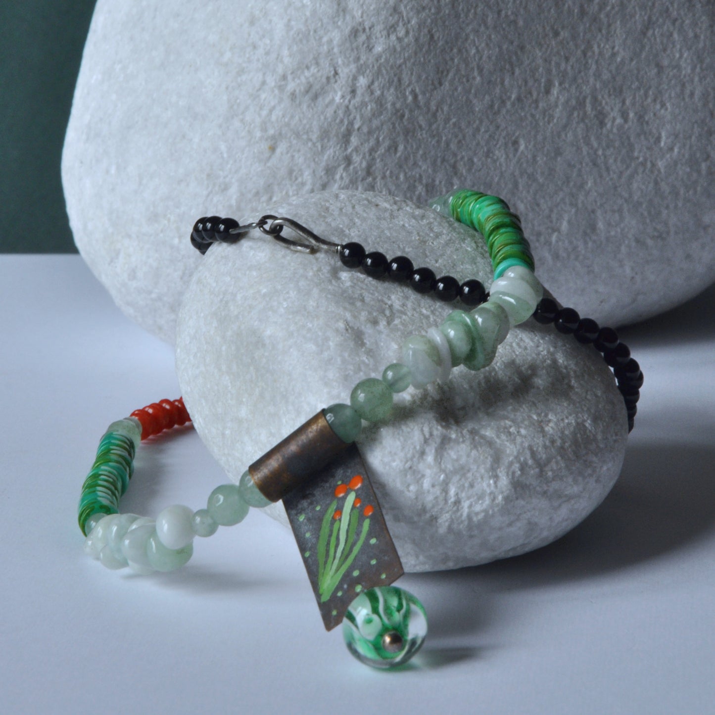 Necklace with a brass pendant, patinated and enameled & with gemstones 'Coral in a Celadon Setting'