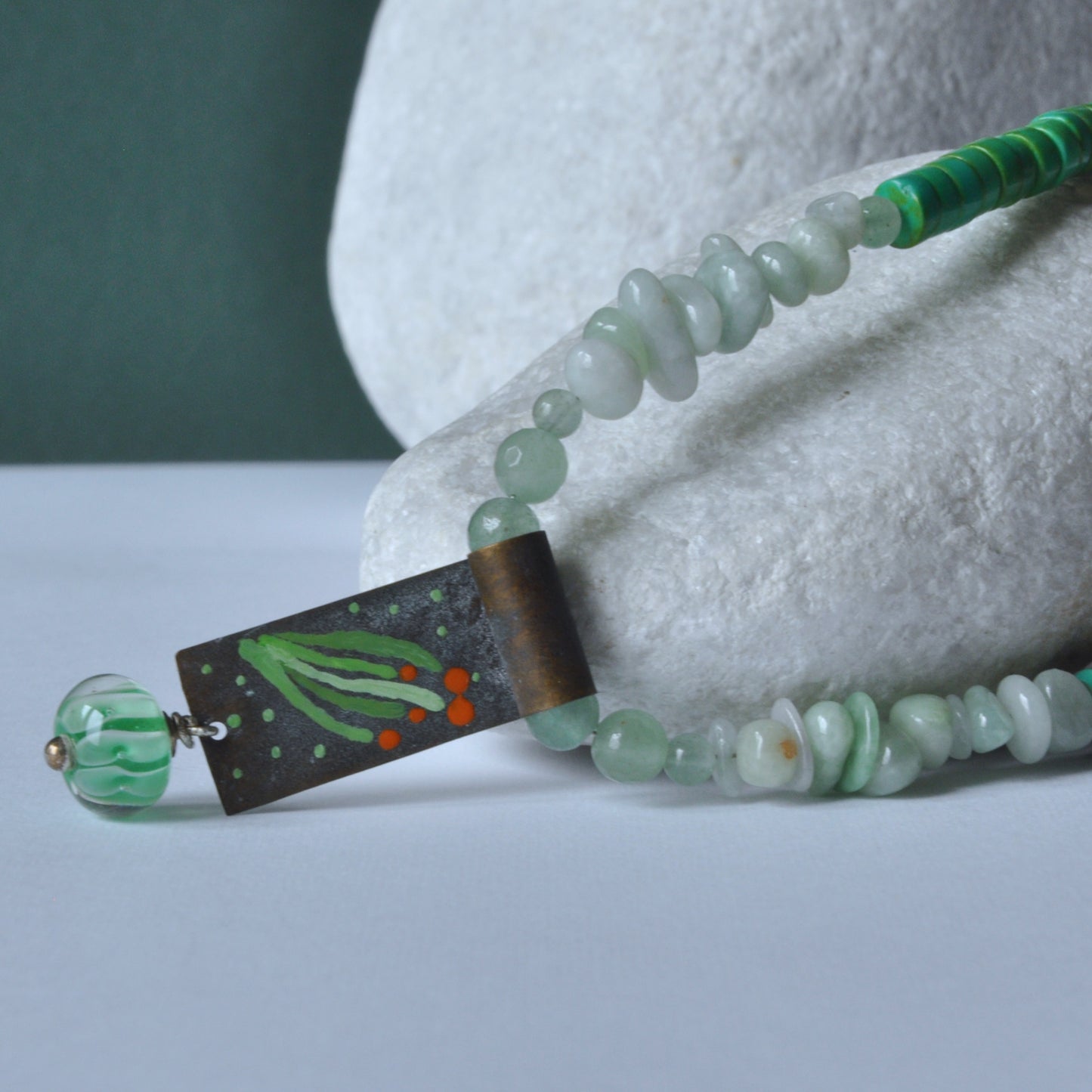 Necklace with a brass pendant, patinated and enameled & with gemstones 'Coral in a Celadon Setting'