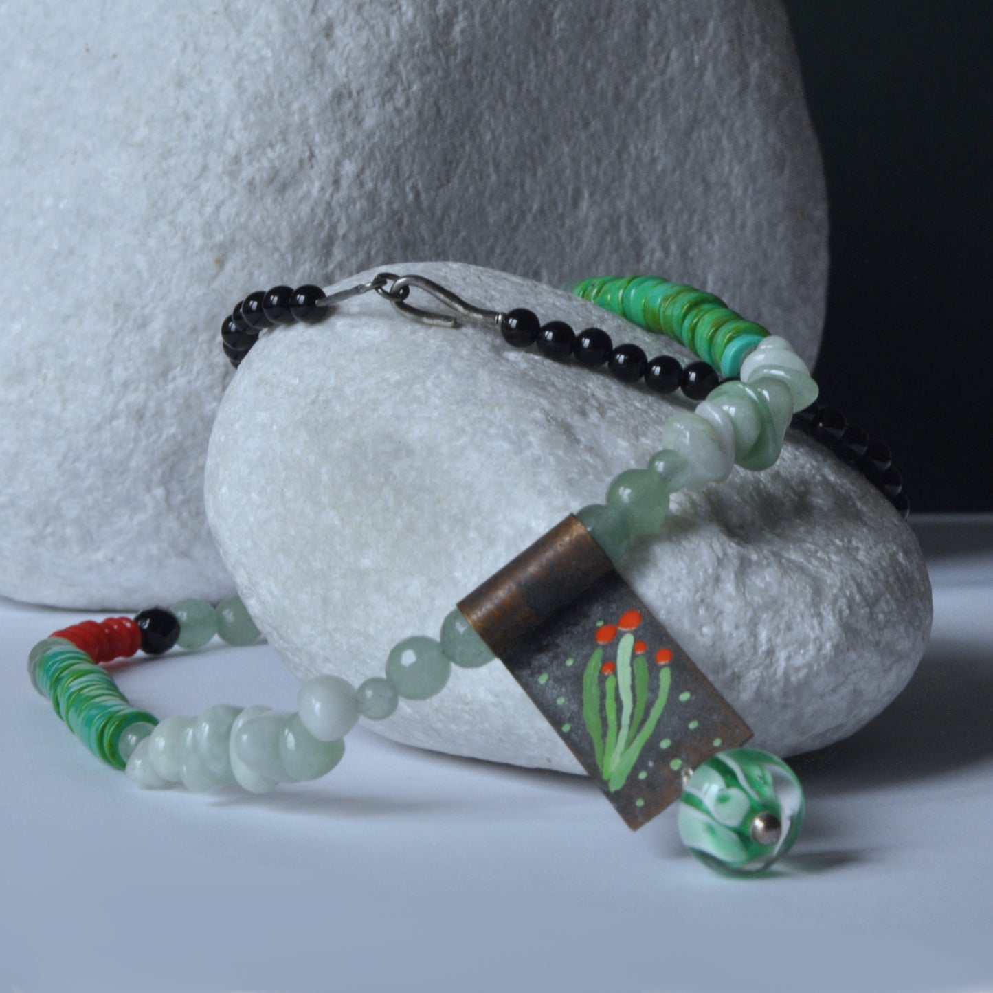 Necklace with a brass pendant, patinated and enameled & with gemstones 'Coral in a Celadon Setting'