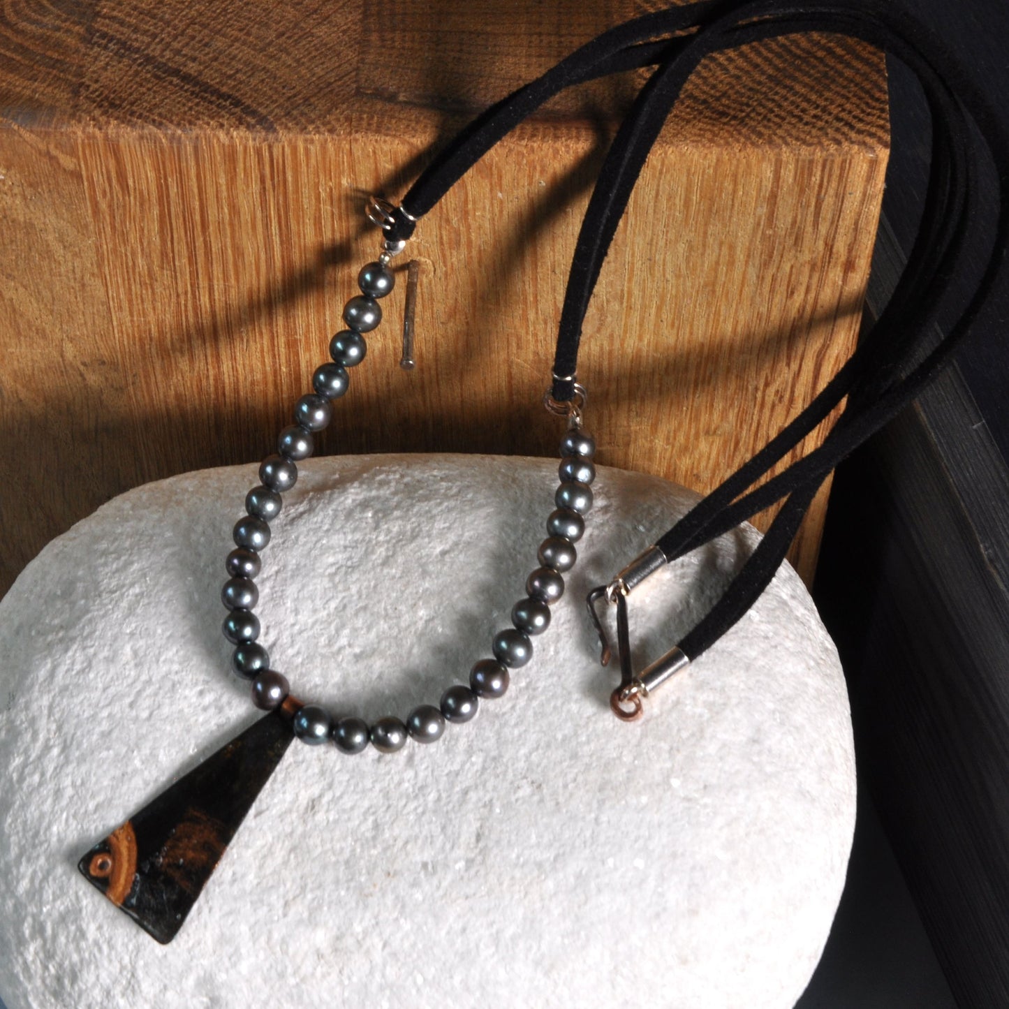 Necklace with a pendant of patinated copper and natural dark pearls 'Black Fish'