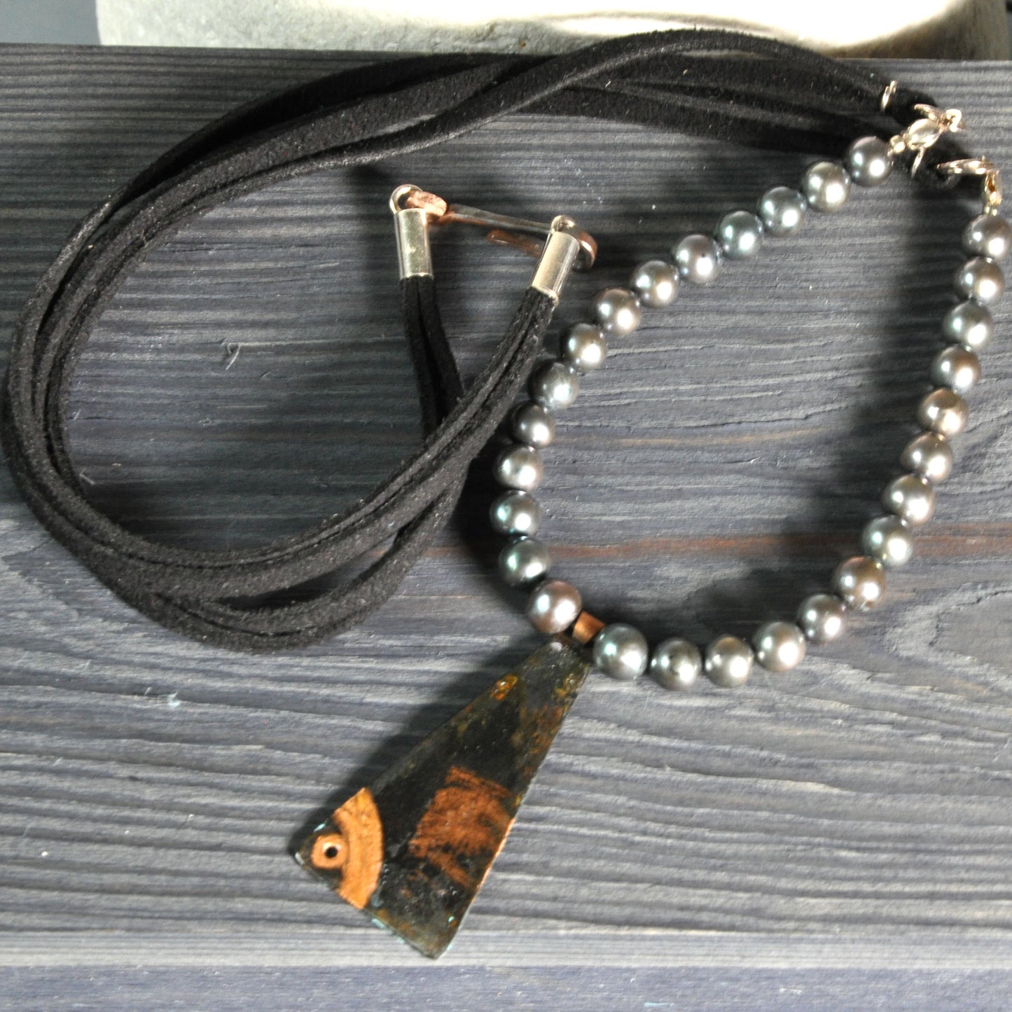 Necklace with a pendant of patinated copper and natural dark pearls 'Black Fish'