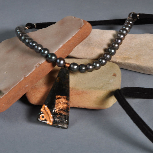 Necklace with a pendant of patinated copper and natural dark pearls 'Black Fish'