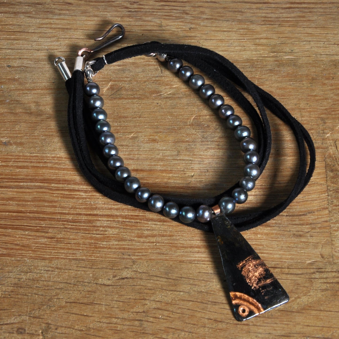 Necklace with a pendant of patinated copper and natural dark pearls 'Black Fish'