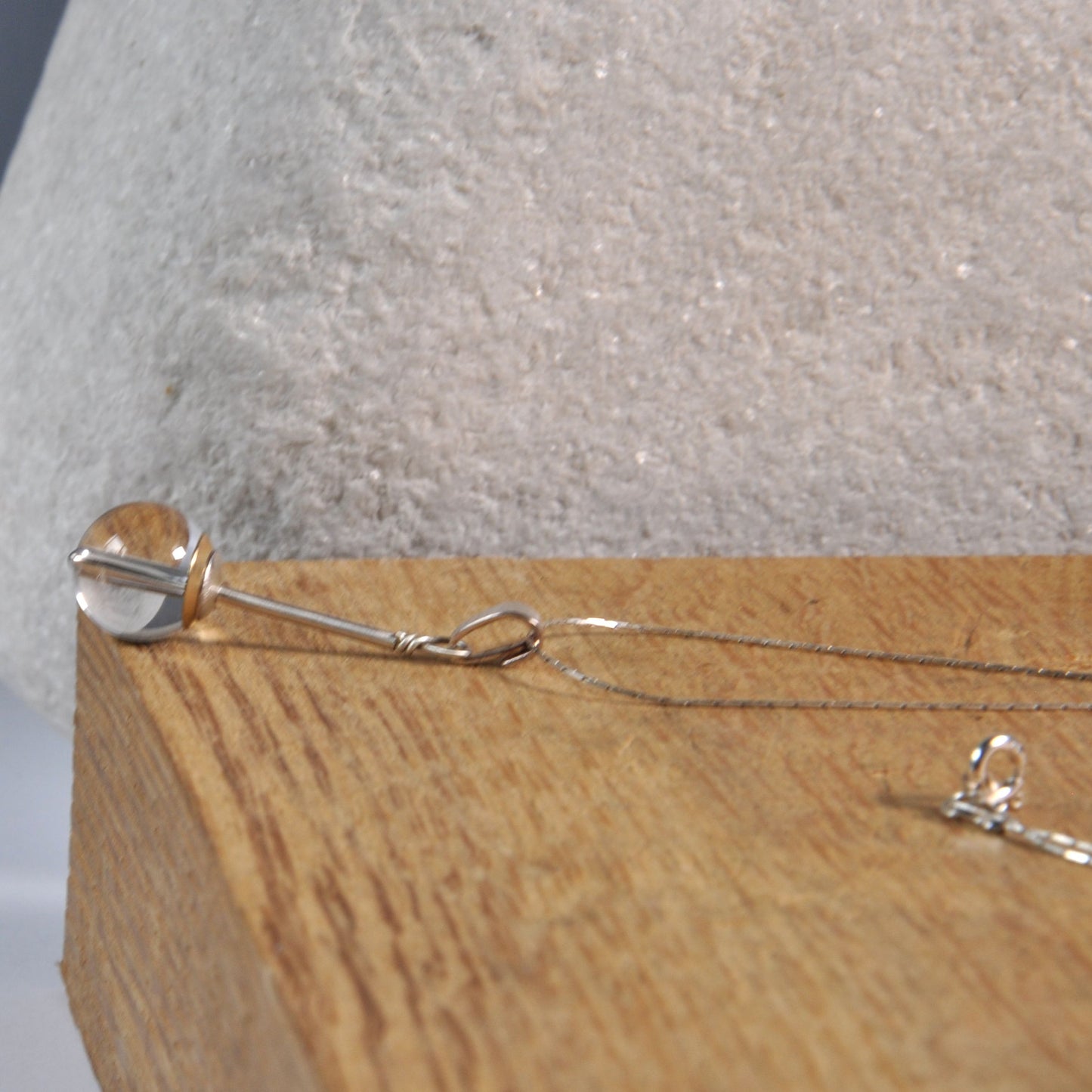 A subtle necklace with a rock crystal 'Pure'