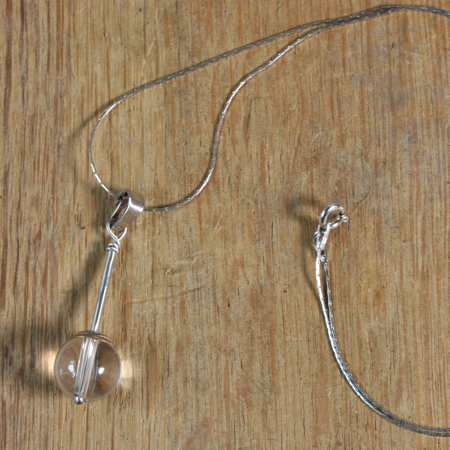 A subtle necklace with a rock crystal 'Pure'