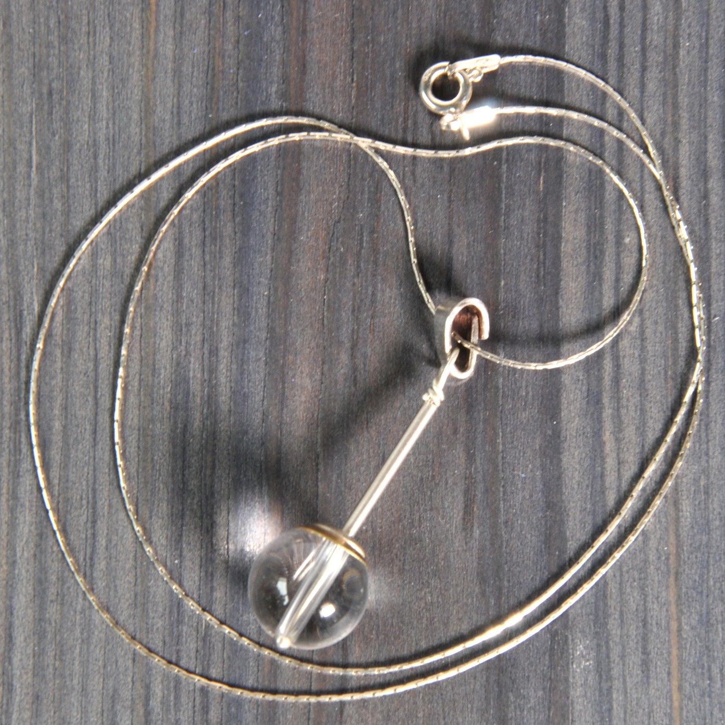 A subtle necklace with a rock crystal 'Pure'