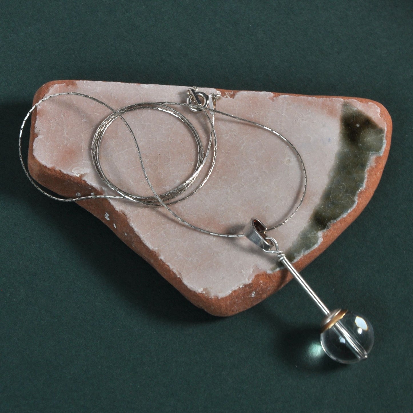 A subtle necklace with a rock crystal 'Pure'