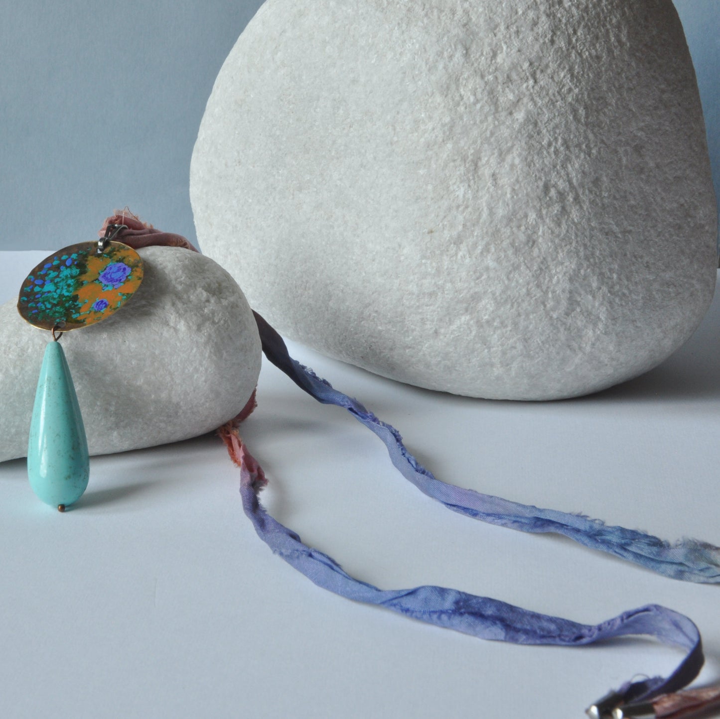 Raw silk necklace with a forged enameled brass pendant and a drop of howlite 'From the Studio Windows'