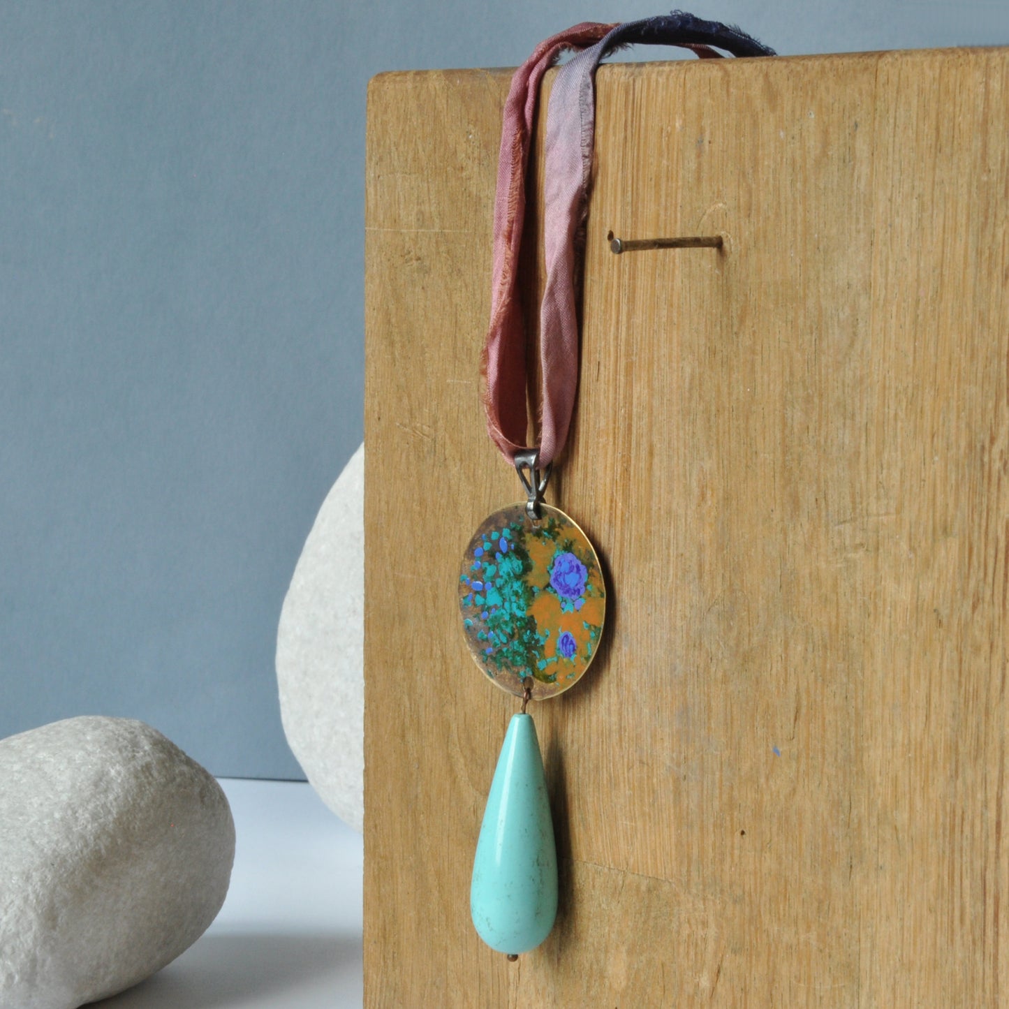 Raw silk necklace with a forged enameled brass pendant and a drop of howlite 'From the Studio Windows'