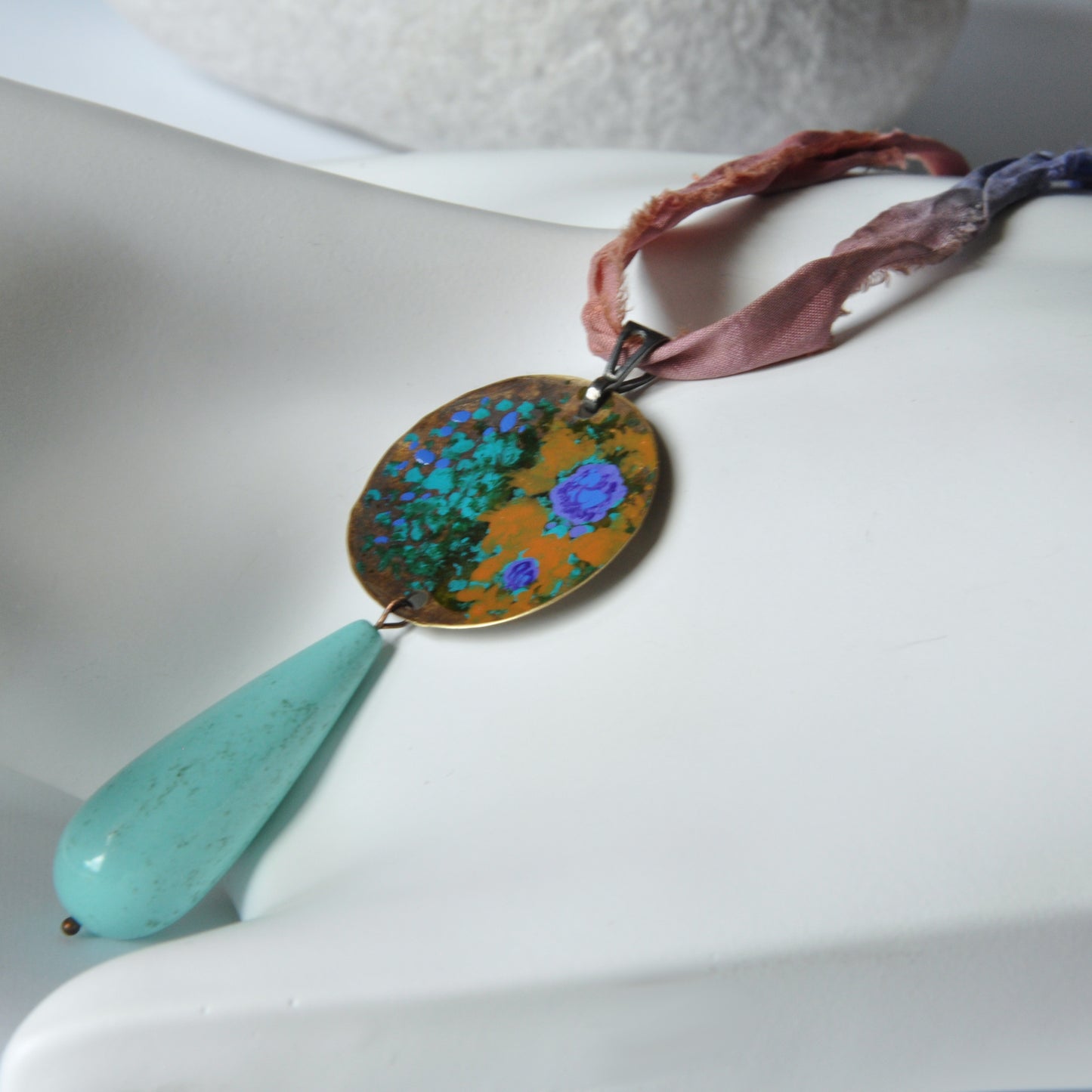 Raw silk necklace with a forged enameled brass pendant and a drop of howlite 'From the Studio Windows'
