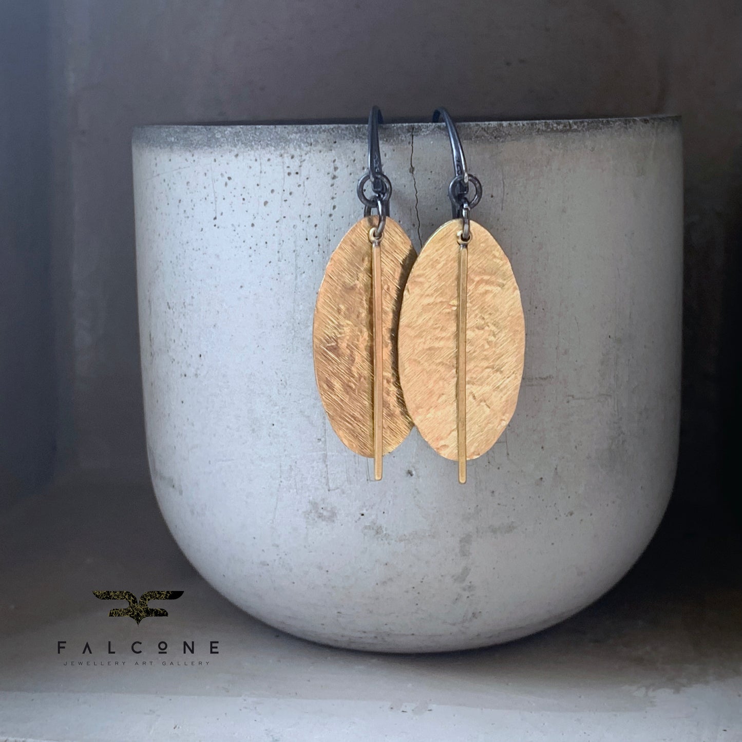 Earrings of raw brass and silver 'Gold Leaves'