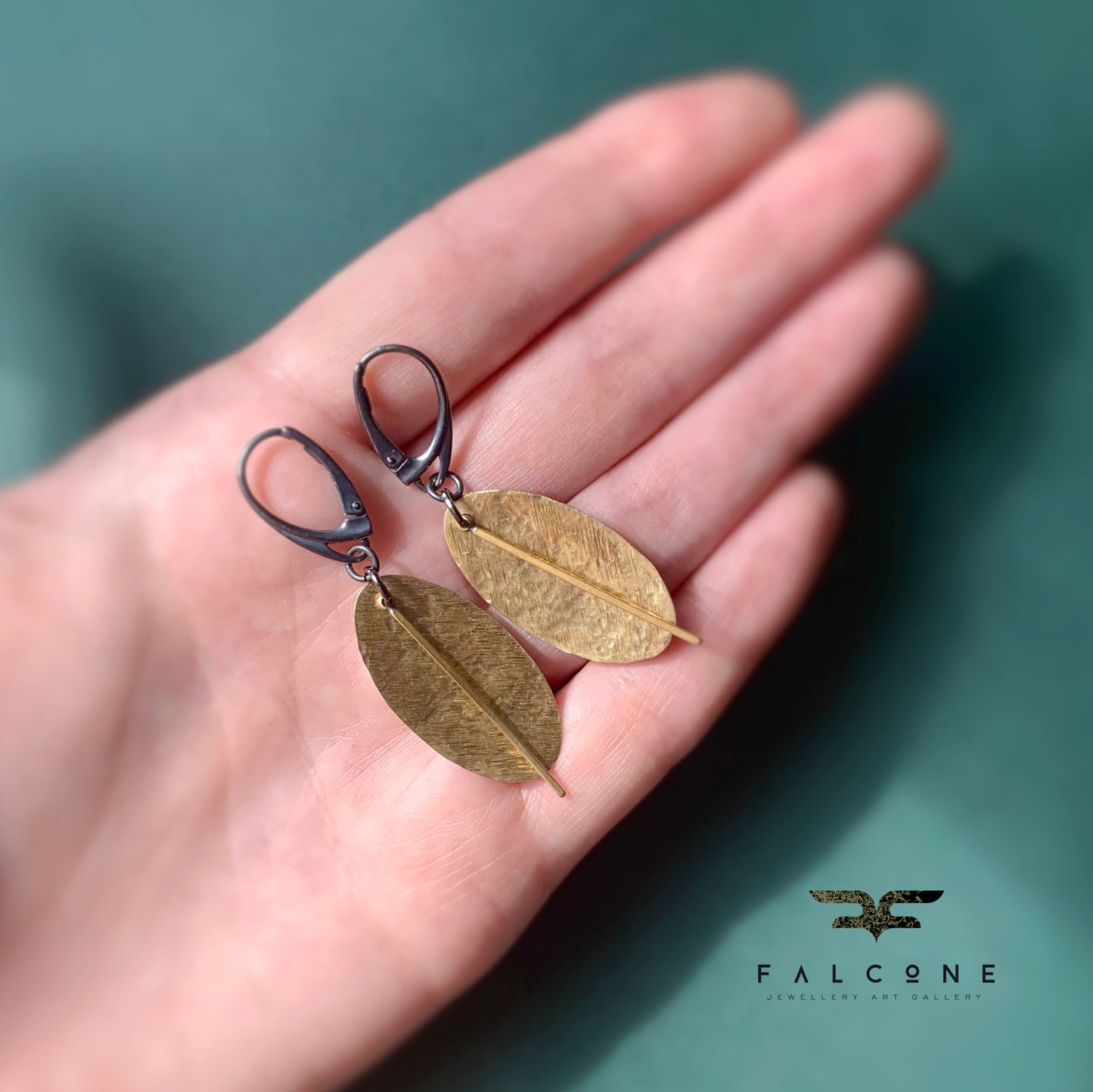 Earrings of raw brass and silver 'Gold Leaves'