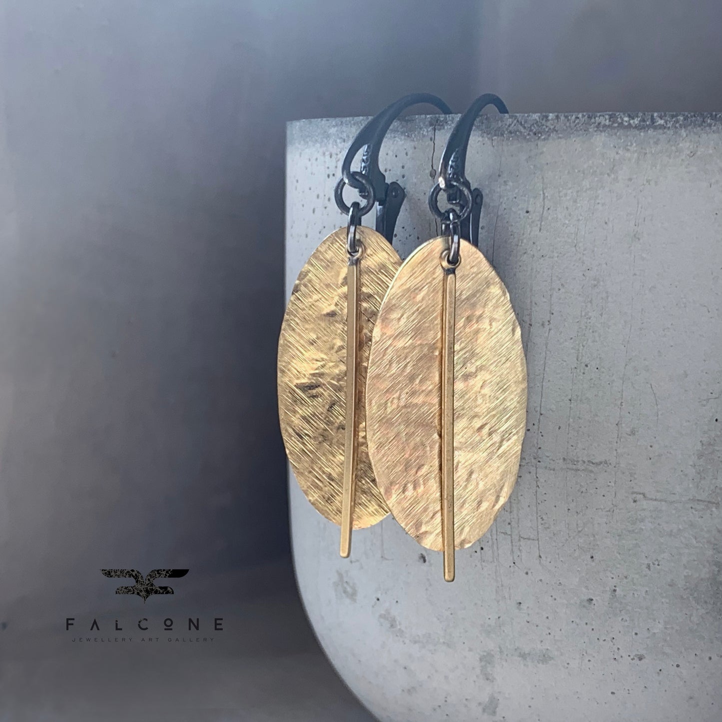 Earrings of raw brass and silver 'Gold Leaves'