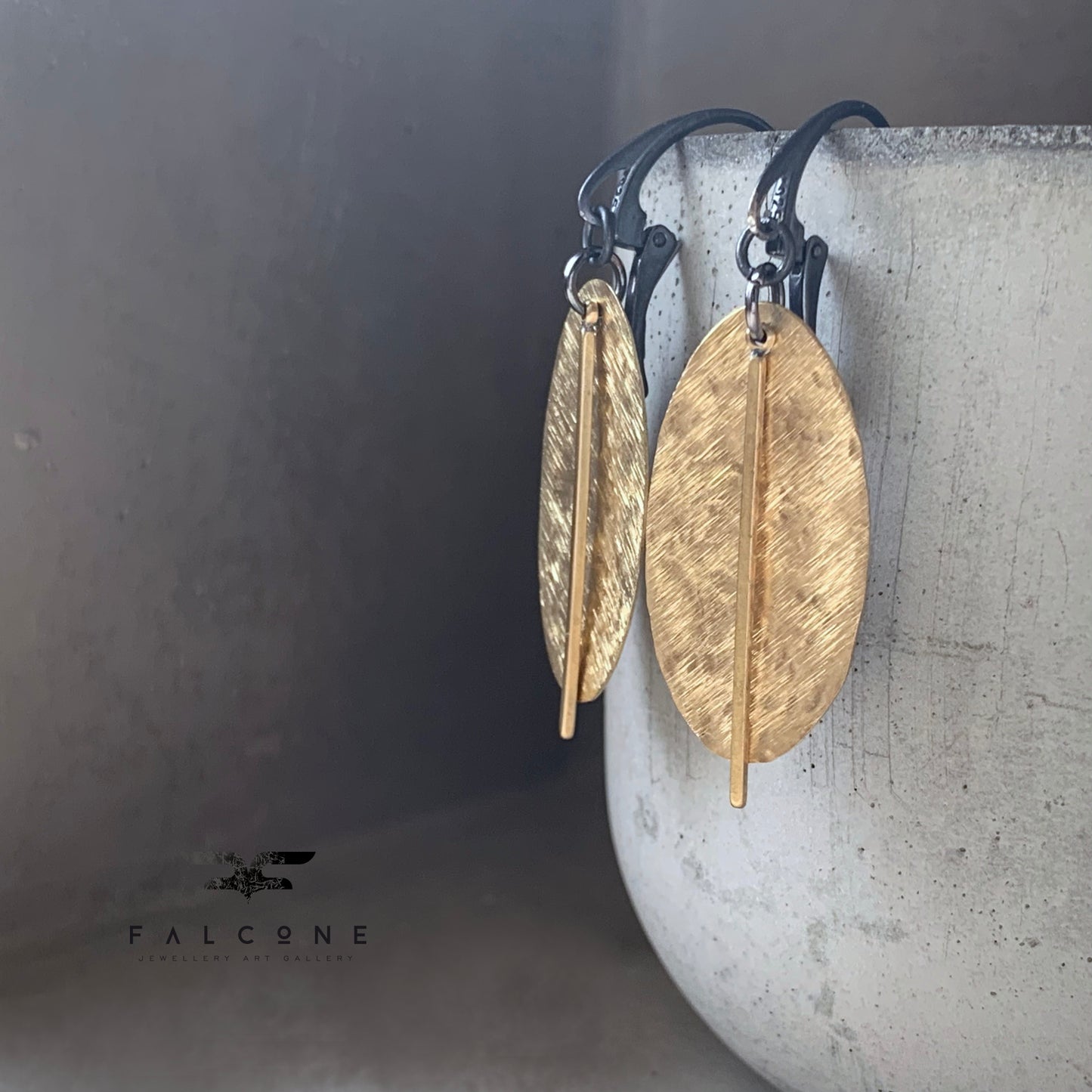 Earrings of raw brass and silver 'Gold Leaves'