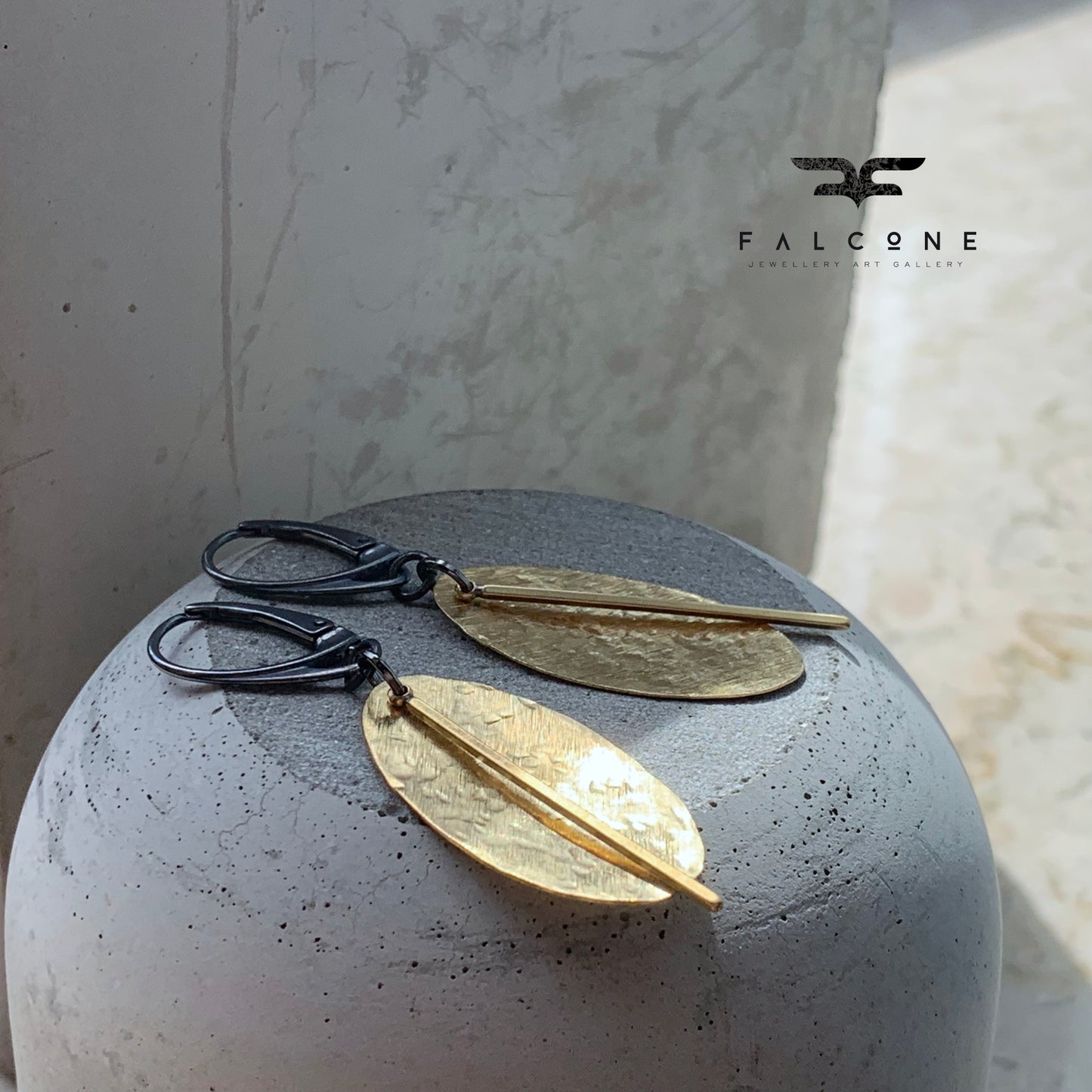 Earrings of raw brass and silver 'Gold Leaves'