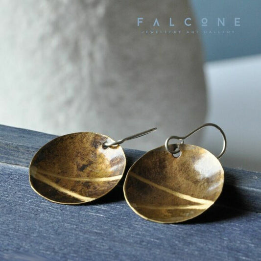 Shining earrings of silver and brass with engraved rays 'Golden Rays'