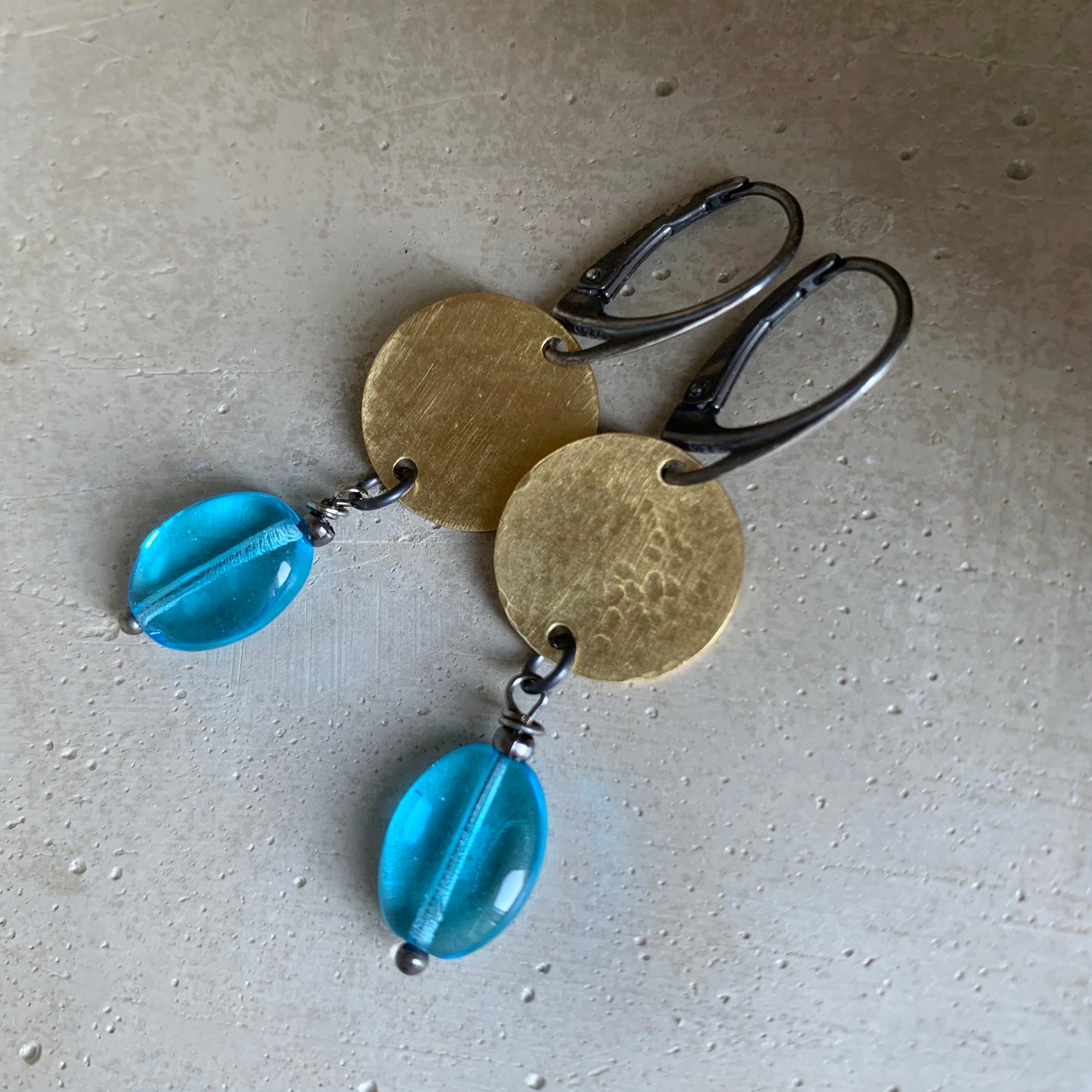 Earrings made of brass, silver, and glass 'Behind the Clouds'