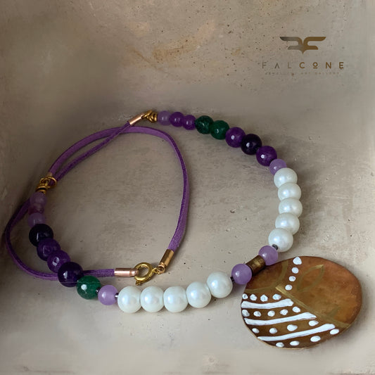 Necklace with engraved and enameled brass pendant, glass pearls and natural stones 'Africana in Purple'