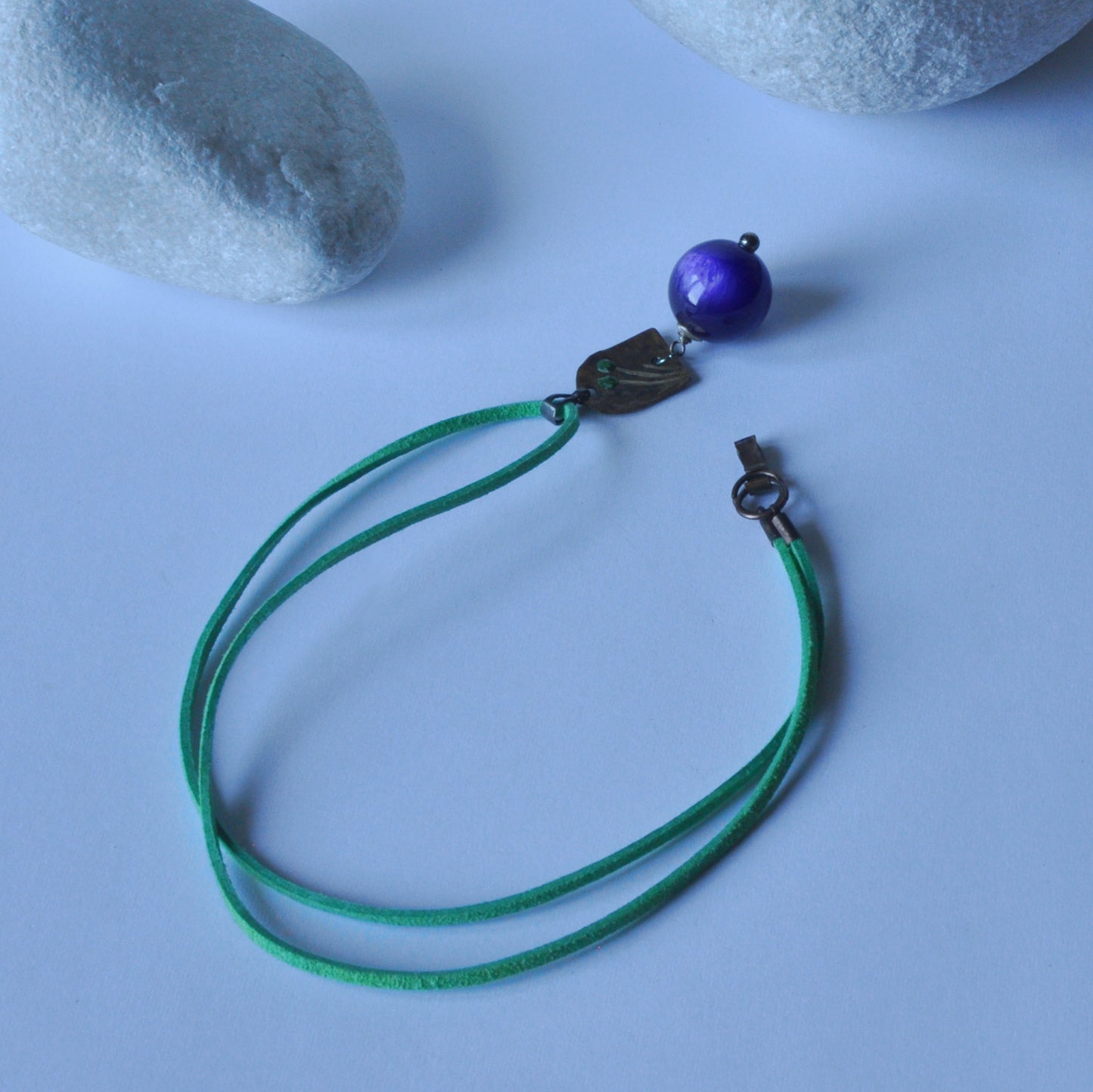 Necklace with patinated brass and engraved pendant and resin ball 'In Green Flowers and Purple'