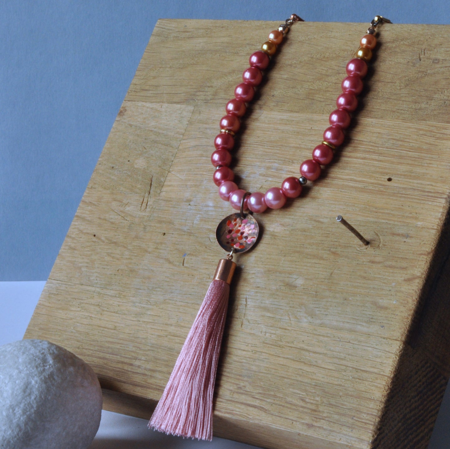 Long necklace with glass pearls and forged and enameled copper pendant 'Powder Pink with Tassel'