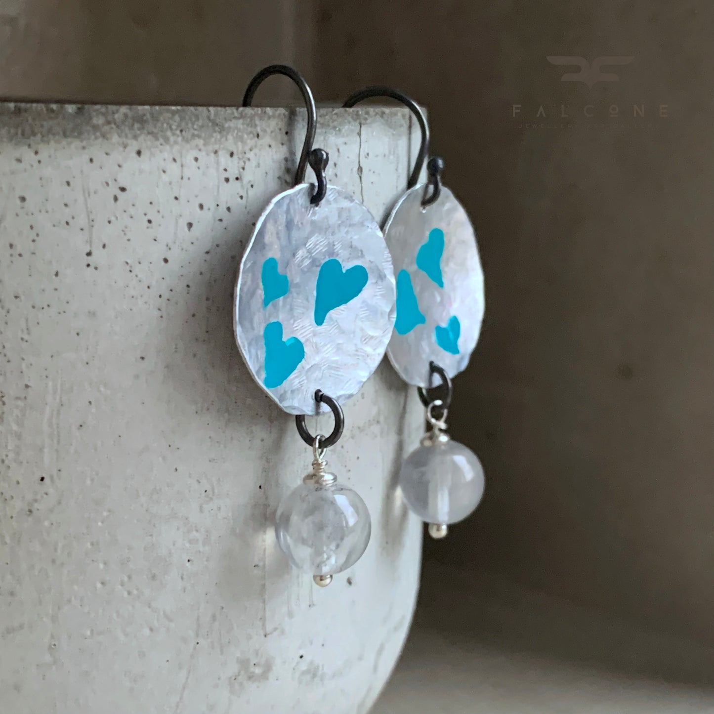 Hand forged aluminium enameled earrings in the shape of irregular circles and with hanging quartz 'Turquoise Hearts'